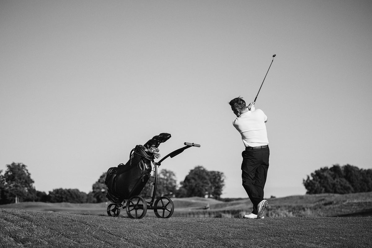 Golfer with a KIFFE trolley
